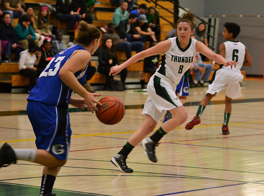 Guard Claire Abbott defends against a dribbling Georgian player. She had four assists in the win.